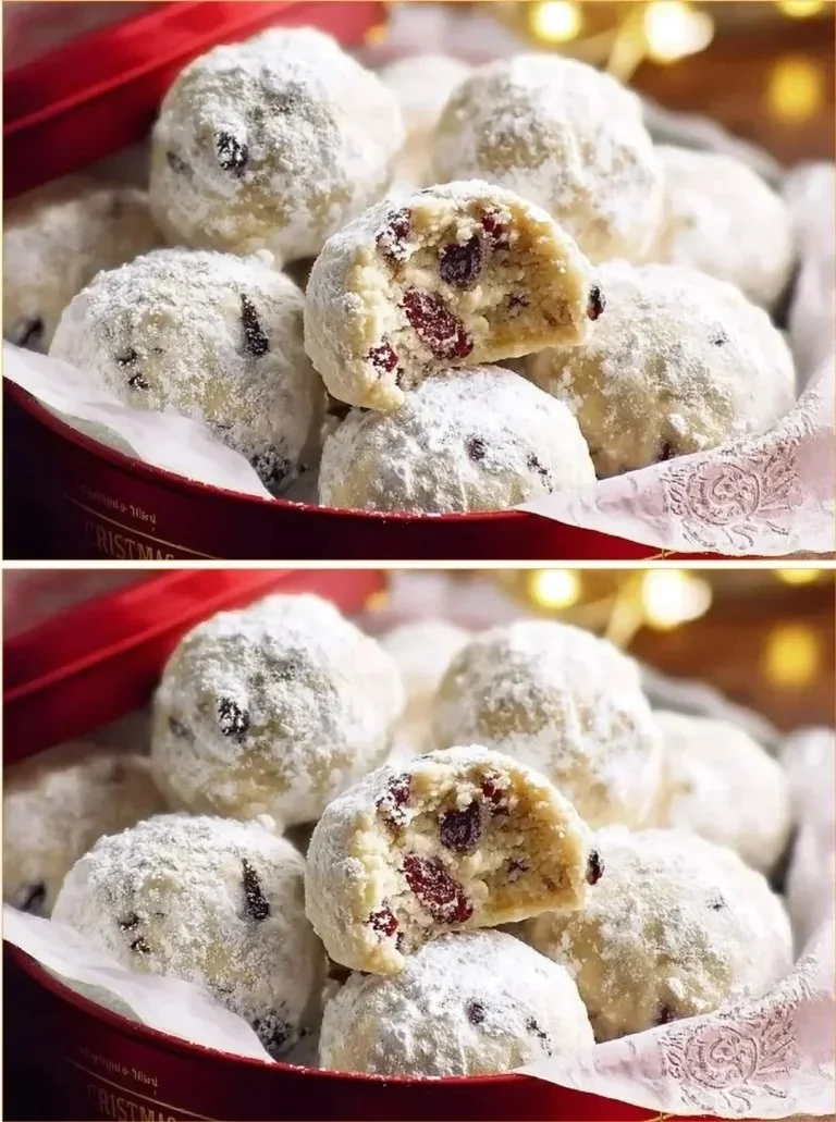 Schneeballen-Kekse mit Cranberries und Orange auf einem dekorativen Teller