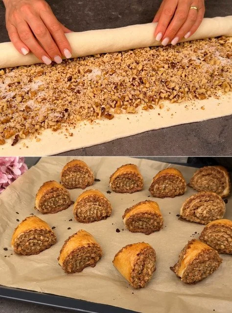 Nussstrudel mit frischen Nüssen und Puderzucker auf einem Teller